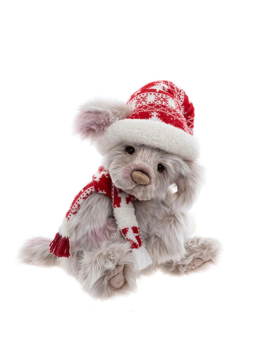 A plush puppy with a red hat