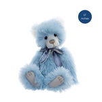 Blue teddy bear with a bow tie on a white background