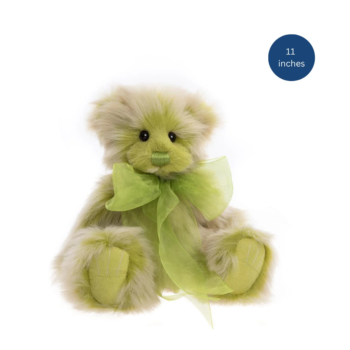 Green teddy bear with a bow tie on a white background