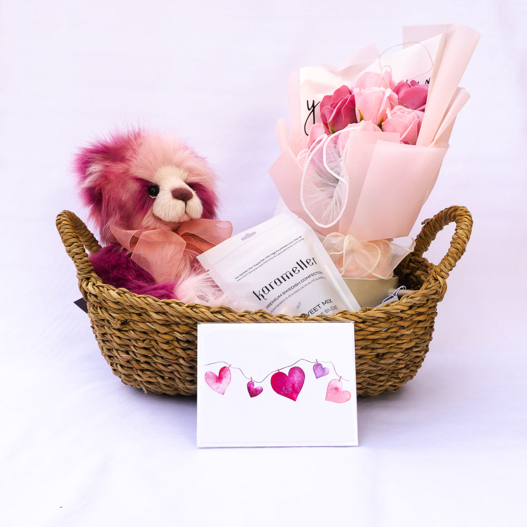 Recipient holding a teddy bear gift