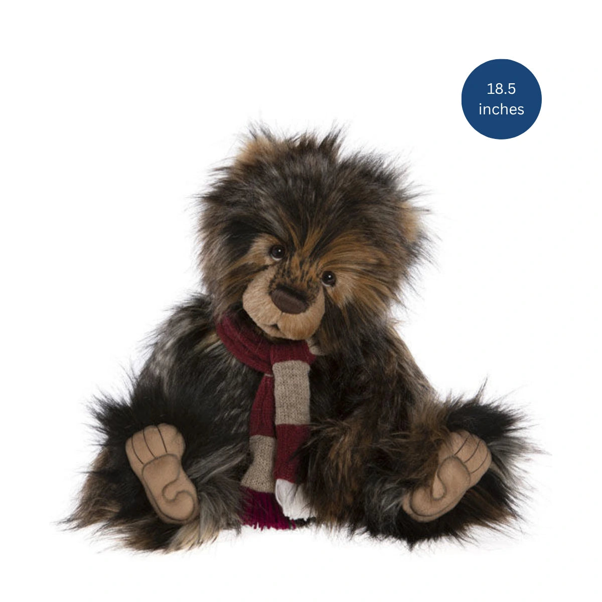 Plush lion toy with a scarf on a white background